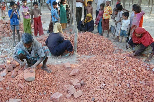 Refugees from Lada Camp work at construction in the camp