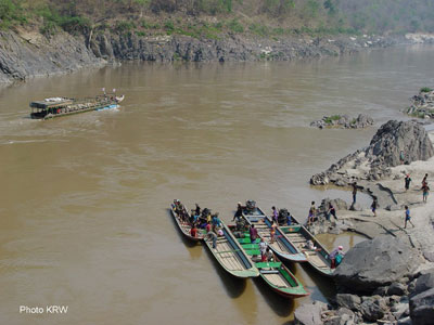 Karen people travel by boat on the Salaween River.