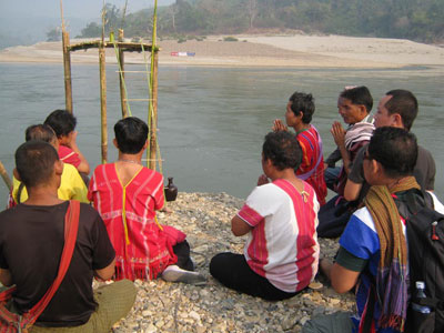 Karen villagers pray during a protest against construction of the Hatgyi Dam in 2010.