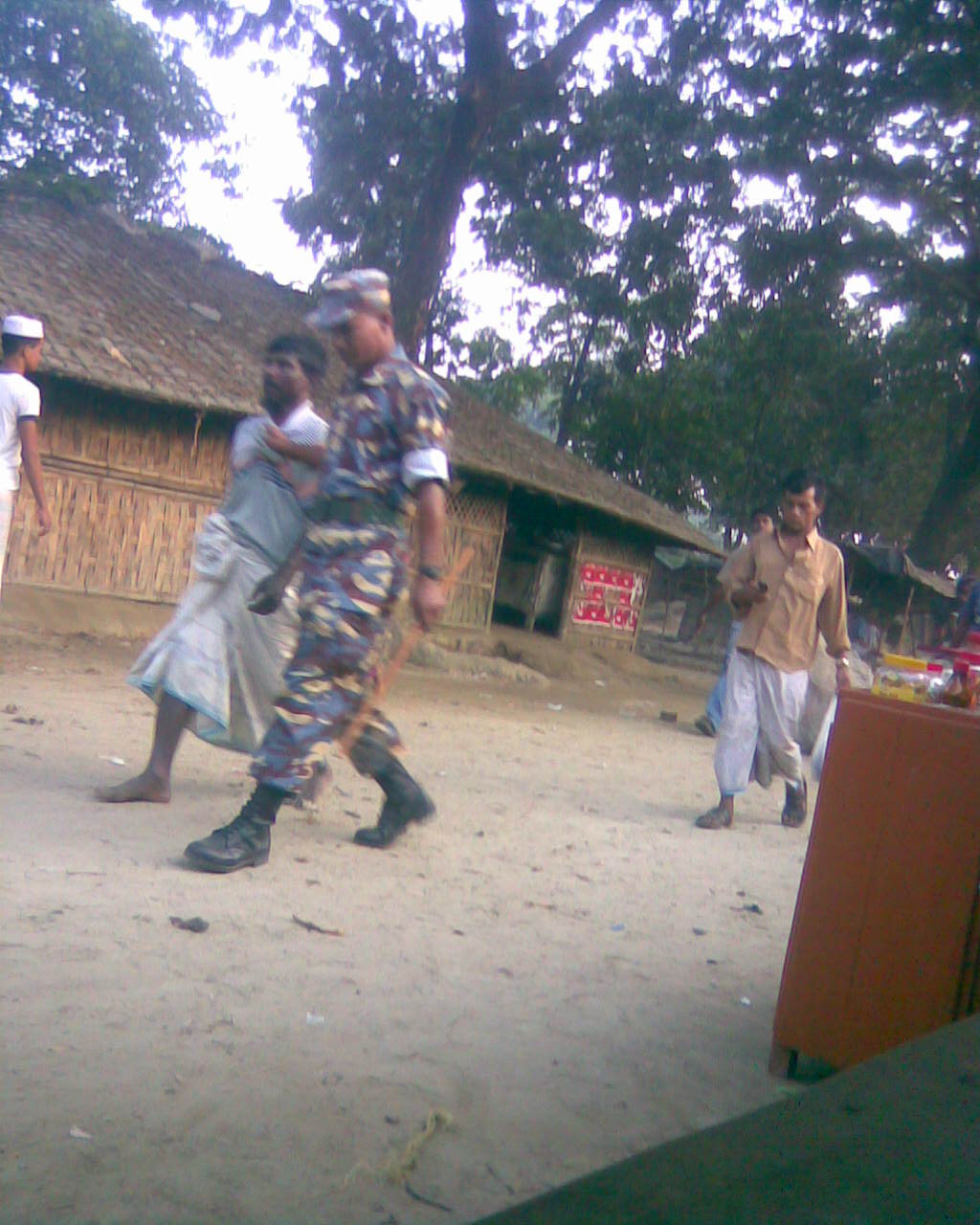 Camp security forces arrested Mr. Nasir  at his shed and dragged him by his shirt to police headquarters