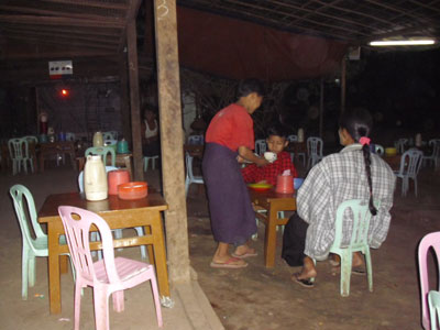 Toe Aung serving customers in his aunt’s restaurant.