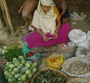 Fatema, a mother of four children, sells food goods to feed her sons and disabled husband because she is not recognized by the UNHCR and Bangladeshi authority at Leda (Tal)  