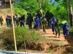 Line-of-convict-Porters-in-blue-uniforms-KHRG