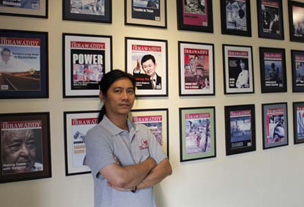 Aung Zaw, The Irrawaddy founder and Editor, with cover photos of their magazine