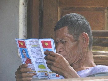 Mon People Reading Mon Party Mi Myint Myint Wai's Election Candidate Pamphlet ( Photo - YPI )