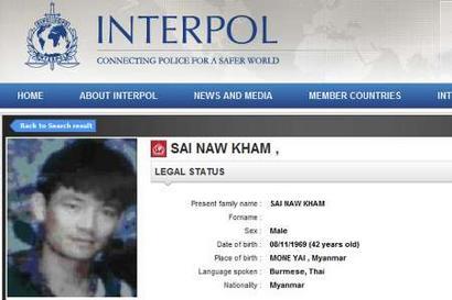 A screenshot from the Interpol website shows a picture of Naw Kham.