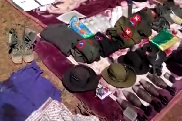 Weapons and uniforms from Burma military column was displayed at the lost government post by the KIA in the frontline in Bhamo (Manmaw) district in Kachin state, Northern Burma.