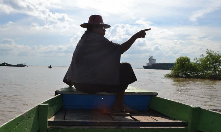  A Thilawa resident points to the planned site of the special economic zone