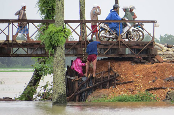 A bridge that has been affected by flooding. 