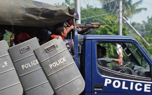 Myanmar-police-patrol-in-truck-photo-Narinjara