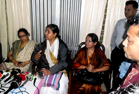 Bangladesh foreign minister (second from left) talks to reporters after visiting Kutupalong refugee camp.