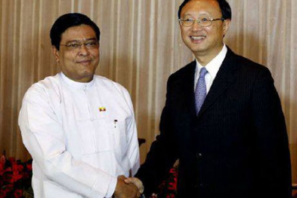 Burma's VP Nyan Tun (left) and Chinese State Councilor Yang Jiechi (right).