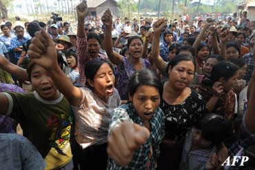 Villagers shout slogans as they protest against Myanmar opposition leader Aung San Suu Kyi's stand on a Chinese-backed copper mine project, in Monywa northern Myanmar on March 14, 2013. Suu Kyi urged protesters to accept a controversial Chinese-backed mine that was the scene of a violent crackdown last year, or risk hurting the economy. AFP PHOTO