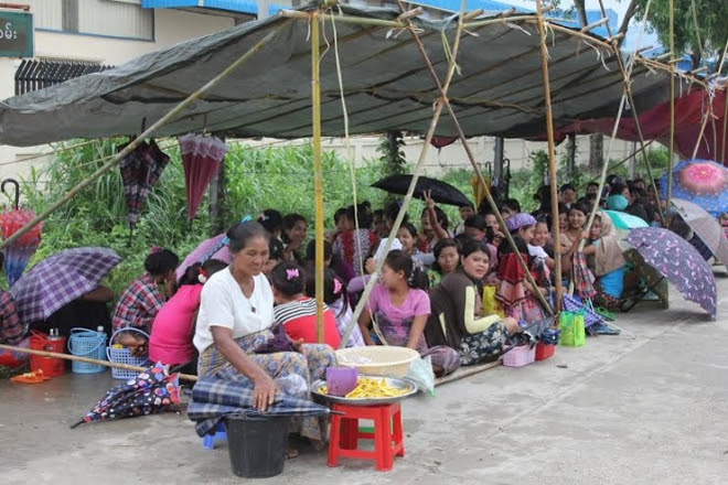 Striking workers outside the Li Kyant Footwear Factory in Yangon&#039;s outer western Hlaing Tharyar Township on June 11. Photo: Nyein Thit Nyi Striking workers outside the Li Kyant Footwear Factory in Yangon's outer western Hlaing Tharyar Township on June 11. Photo: Nyein Thit Nyi