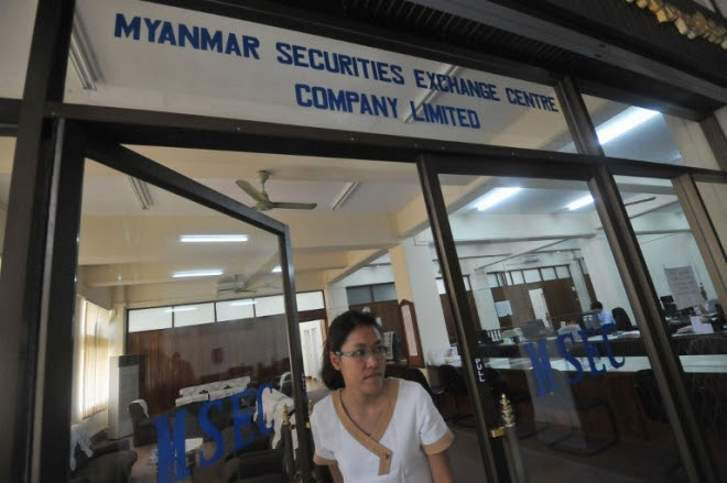 A woman leaving the Myanmar Securities Exchange Center (MSEC) in Yangon AFP PHOTO/ Soe Than WIN