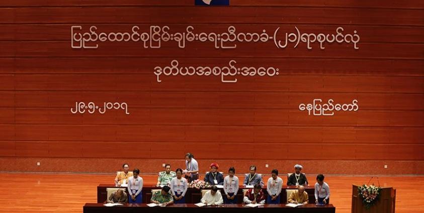 (L-R first row) Thu Wai, Chairman Democratic Party, Lt-general Tin Maung Win, Tin Myo Win Chairman of Peace Commission, KNU vice chairman Saw kawl Htoo win and Lower house parliament member Htun Htun Hain sign during the Union Accord signing during the closing ceremony of the second session of the 'Union Peace Conference - 21st century Panglong' in Naypyitaw, Myanmar, 29 May 2017. Photo: Hein Htet/EPA