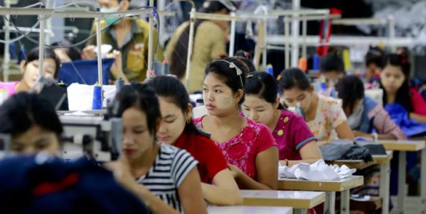 Employees work at a garment factory in Shwe Pyi Thar, Yangon, Myanmar. Photo: Nyein Chan Naing/EPA