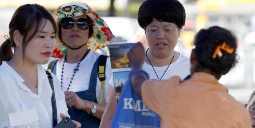 Chinese tourists at the Maha Bandoola park in Yangon, Myanmar. Photo: Nyein Chan Naing/EPA