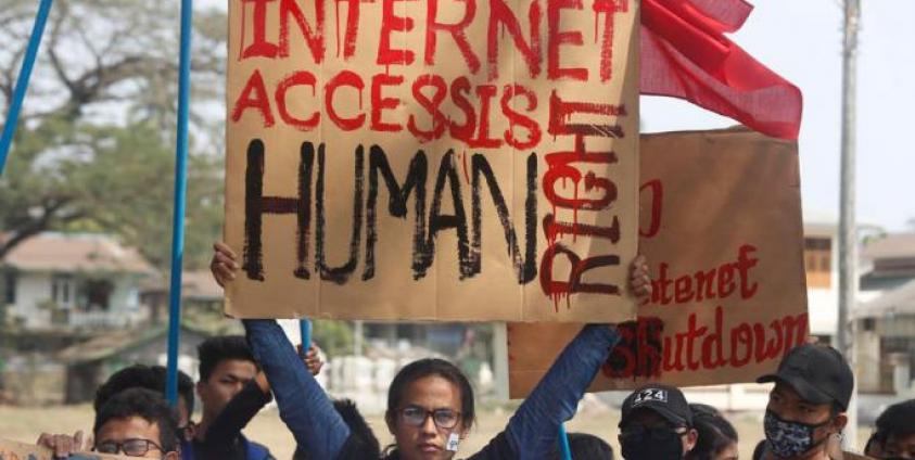 Rakhine University Students hold placards during a protest against the internet shutdown in Sittwe, Rakhine State, Western Myanmar, 22 February 2020. Photo: Nyunt Win/EPA