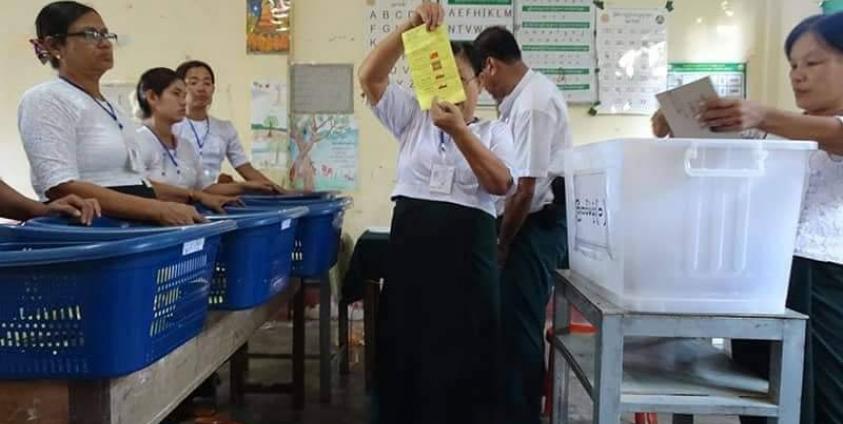 Votes are counted at a polling station in Sittwe during the 2020 general election.