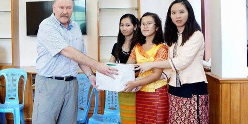 Representatives from the Shan community present a petition opposing the Mongton Dam to SMEC at their office in Yangon on 25 August 2015. (Photo by Action for Shan State Rivers)