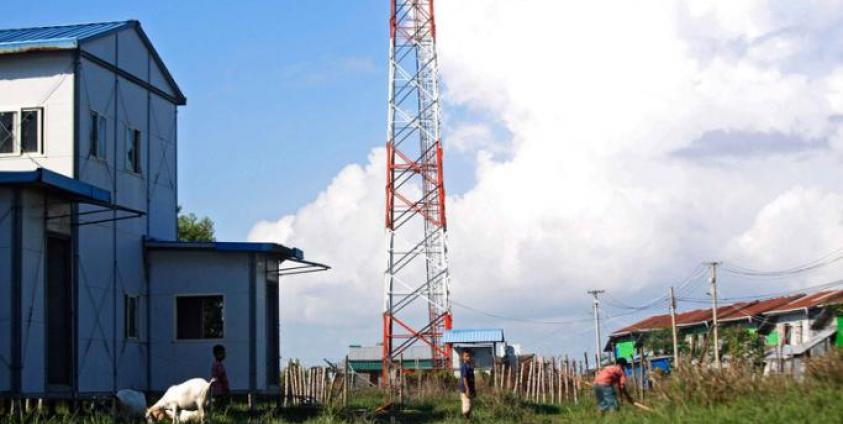 Rakhine children play near a telecommunications tower at Sat Yoe Kya Ward, Sittwe, Rakhine state, Myanmar. Photo: Nyunt Win/EPA