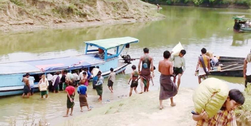 Aid Supplies being Unloaded from a Boat at Sapa Seik Village