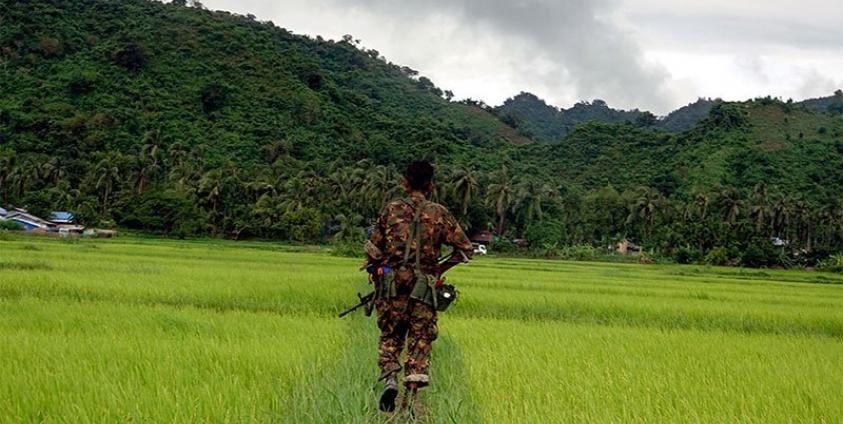 Myanmar soldier walks in Chain Khar Li Rakhine ethnic village, an area close to fighting at Rathedaung township of northern Rakhine State, western Myanmar, 25 August 2017. Photo: Nyunt Win/EPA