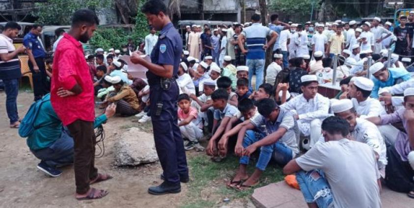 Policeman takes the details of Rohingya refugees who were detained from a beach, at the Sadar Model police station in Cox's Bazar. Bangladesh police detained at least 450 Rohingya refugees as they celebrated the Muslim festival of Eid on a popular beach, officials said on May 5, 2022. Photo: AFP