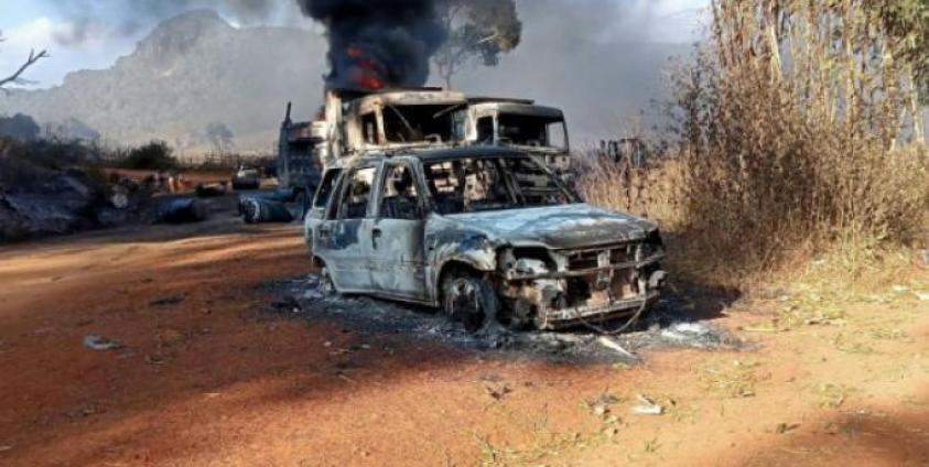 two burnt-out trucks and a car on a highway in Hpruso township (AFP/Handout)