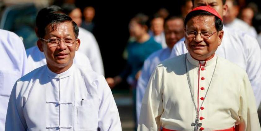 Commander-in-Chief of the Myanmar Armed Forces, General Min Aung Hlaing (L), walks next to Cardinal Charles Maung Bo (R) as he leaves after visiting St. Mary's Cathedral on Christmas Day in Yangon, Myanmar, 25 December 2019. Photo: Lynn Bo Bo/EPA