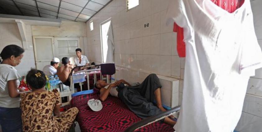 A patient lying on a bed at a charity-run clinic in Yangon. Photo: AFP