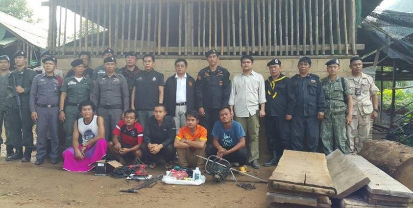 The arrested men with the Thai authorities (photo from the AEC News Facebook page)