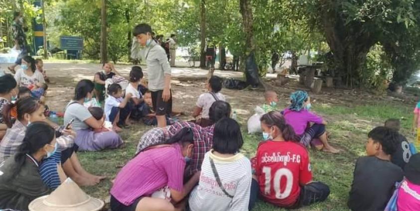 Residents from Thay Thaw Boe village flee junta air raids on May 18.