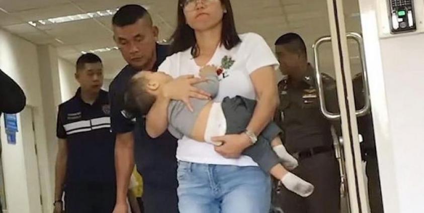 The wife of Myanmar's Arakan Army leader, Ms Hnin Zar Phyu, seen here with one of their children, had been detained in Thailand. Photo: RFA/YouTube