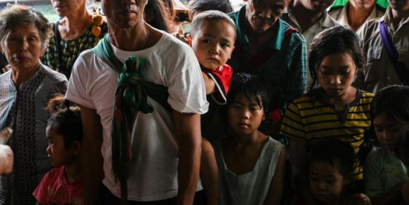 This photo taken on August 25, 2019 shows people, affected by clashes between the military and ethnic rebel groups, waiting to receive supplies from local civil society organisations in Man Lwal village, outside Kutkai in Shan State. Photo: Ye Aung Thu/AFP