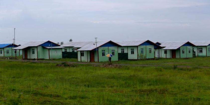 (File) A man walks in front of the newly built houses for resettlement at the Kyauk BanDu village in Maungdaw township, Rakhine State, western Myanmar, 23 August 2018. Photo: Nyein Chan Naing/EPA