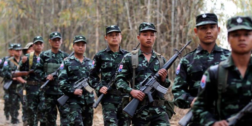 (File) Karen National Union (KNU) guerillas with their weapons parade. Photo: Rungroj Yongrit/EPA