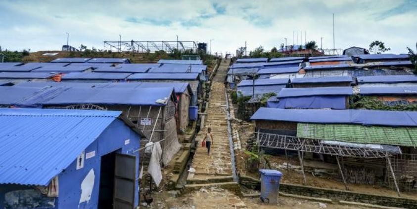 A Rohingya child walks down from a hill at Kutupalong refugee camp in Ukhia on July 24, 2019. Photo: Munir Uz Zaman/AFP 