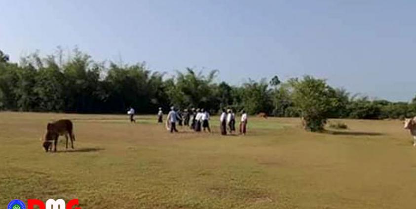 Concerned officials look at virgin lands for construction of government offices in Ashae Phat Hmaw Village. (Photo - Ko Maung Maung Gyi)