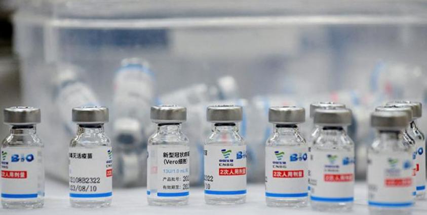 Empty vials of the Sinopharm Covid-19 coronavirus vaccine are kept on a table at a vaccination centre in Hanoi on September 10, 2021. Nhac NGUYEN / AFP