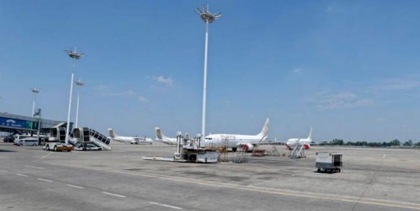 Myanmar National Airlines (MNA) aircraft parked on the tarmac as commercial flights remain temporarily suspended as part of the measures to control the spread of the COVID-19 coronavirus disease, at Yangon International Airport in Yangon, Myanmar, 10 May 2020.  Photo: EPA