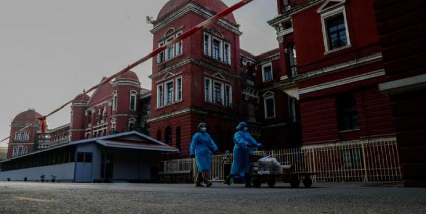 Staff members push a food trolley to deliver breakfast at the Yangon General Hospital, in Yangon, Myanmar, 24 January 2021. Photo: EPA