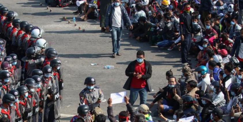 BBC correspondent Aung Thura (top, C-L) and Mizzima journalist Than Htike Aung (C-R) walk among demonstrators during a protest in Naypyidaw, 08 February 2021. - EPA