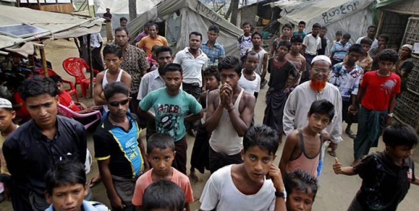 (File) Muslim people gathering near temporary tents at the Thel Chaung Muslim majority village during a census taking near Sittwe, Rakhine State, western Myanmar, 01 April 2014. Photo: Lynn Bo Bo/EPA