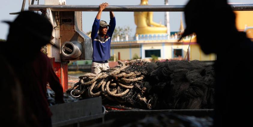 Myanmar migrant fishermen work at a port in Samut Sakhon province, Thailand. Photo: Rungroj Yongrit/EPA-EFE