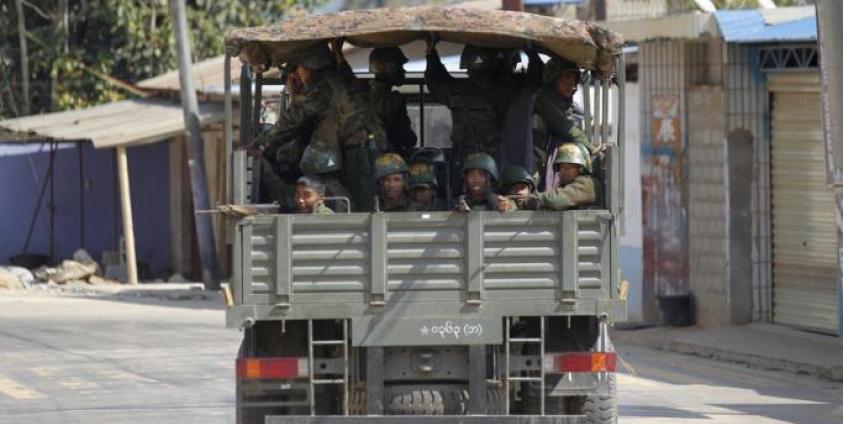 (File) Military truck loaded soldier passes along a deserted road at self-administered Kokang capital Laukkai, northern Shan State, Myanmar, 17 February 2015. Photo: Lynn Bo Bo/EPA