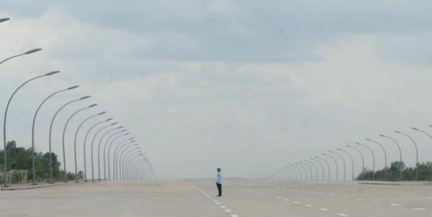 A policeman awaits traffic to direct in Nay Pyi Taw, Myanmar. Photo: AFP