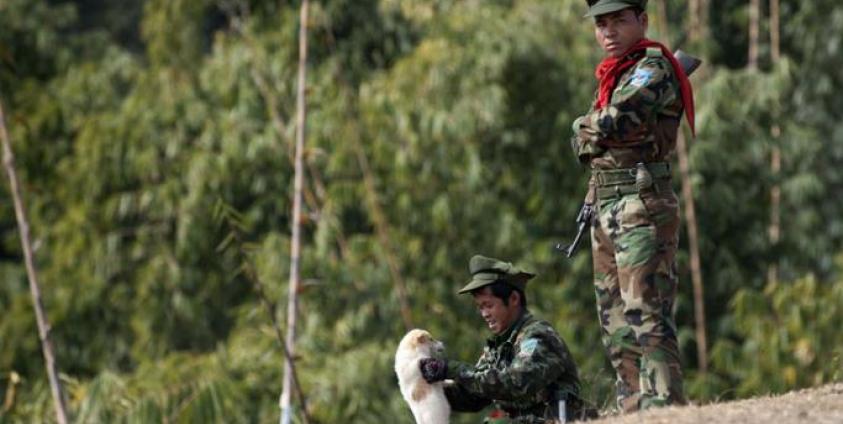 Taaung National Liberation Army (TNLA), a Palaung ethnic armed group, standing guard outside a village in Mantong township, in Myanmar's northern Shan state. Photo: Ye Aung Thu/AFP