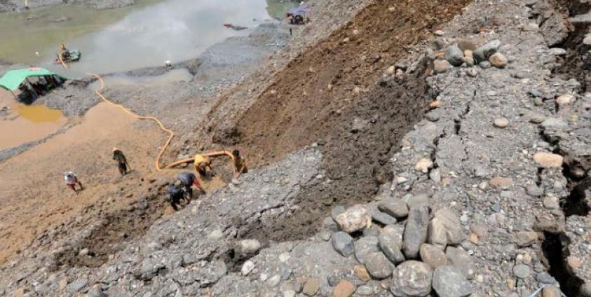 Miners search for jade stones at the HpaKant jade mining area, Kachin State. Photo: Nyein Chan Naing/EPA